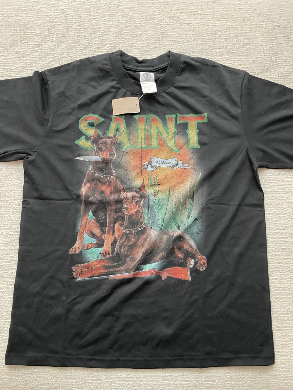 Saint M Black Graphic Tee with Doberman "SAINT Ribbons" Print